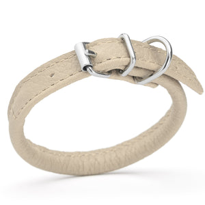 Beige leather dog collar with metal hardware, 1/4 inches wide